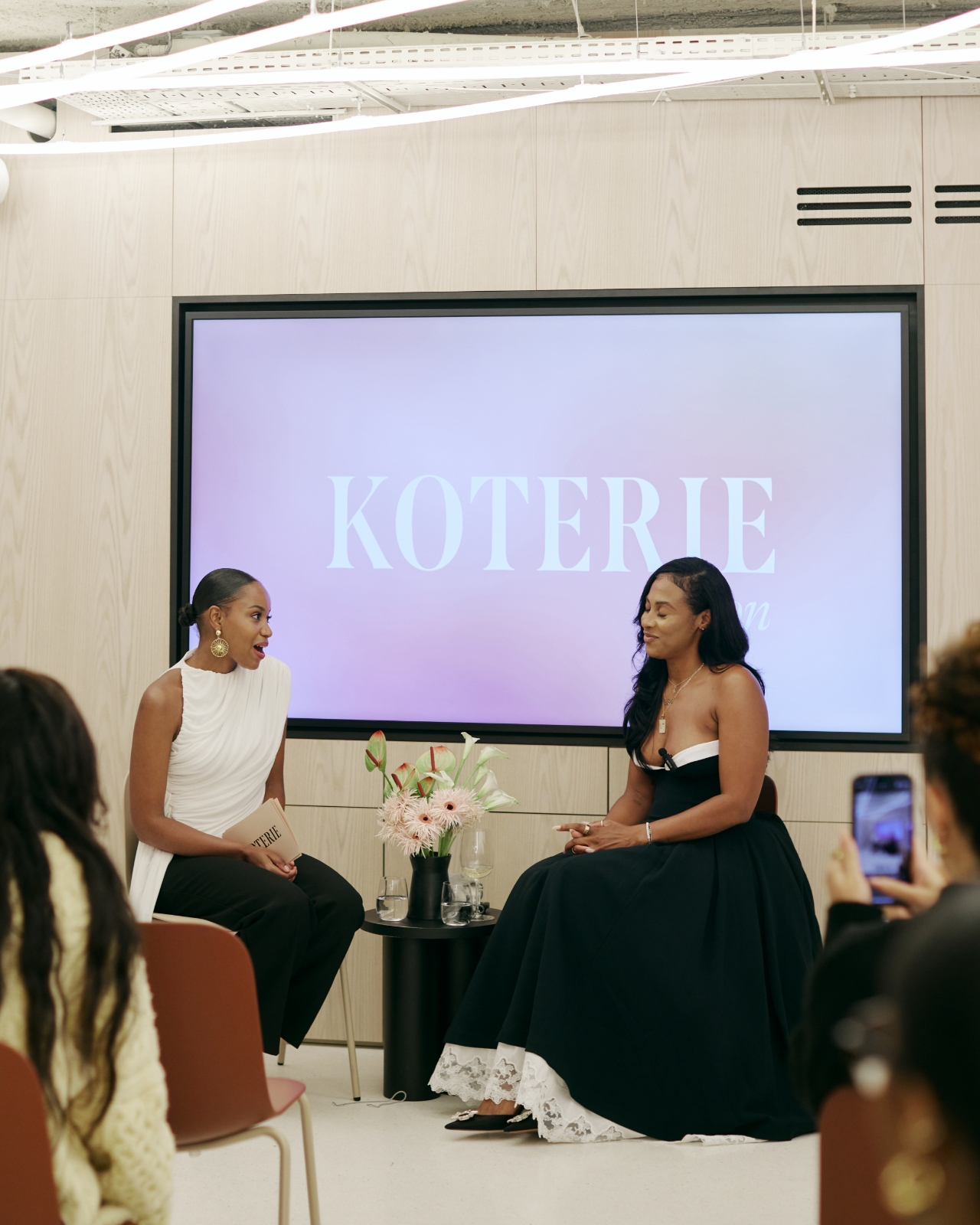 Koterie members sharing a toast.